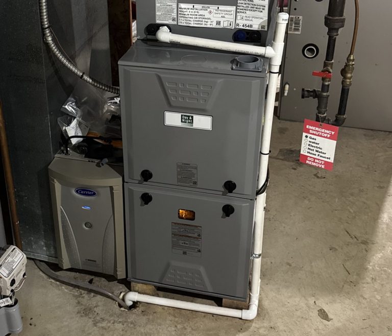 Day & Night high-efficiency furnace installed in a basement next to the water heater